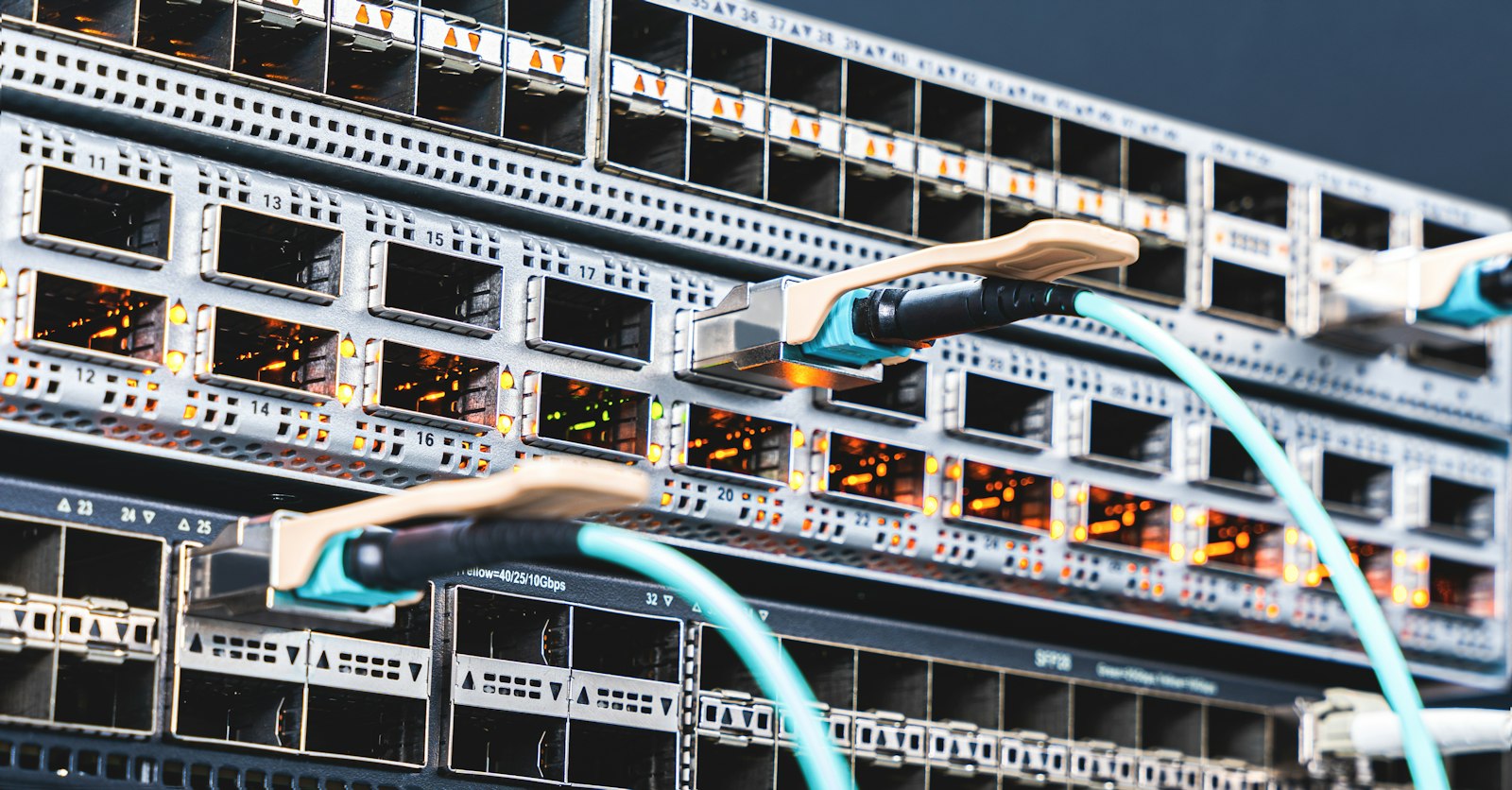 Wires and cables connected to networking equipment in a server rack