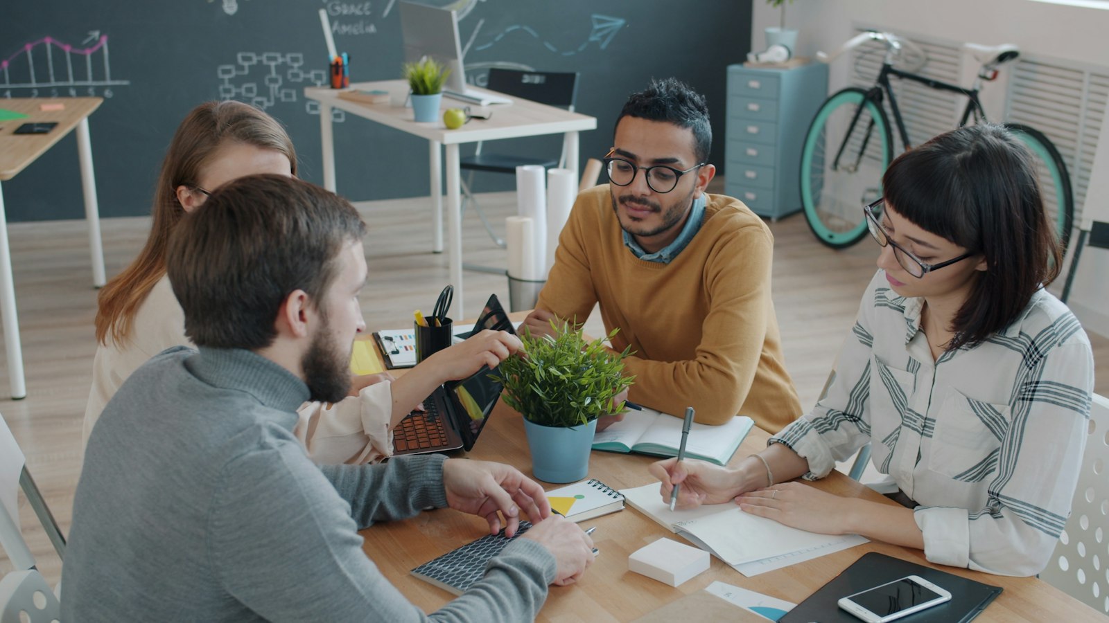 Team discussing options together around a table