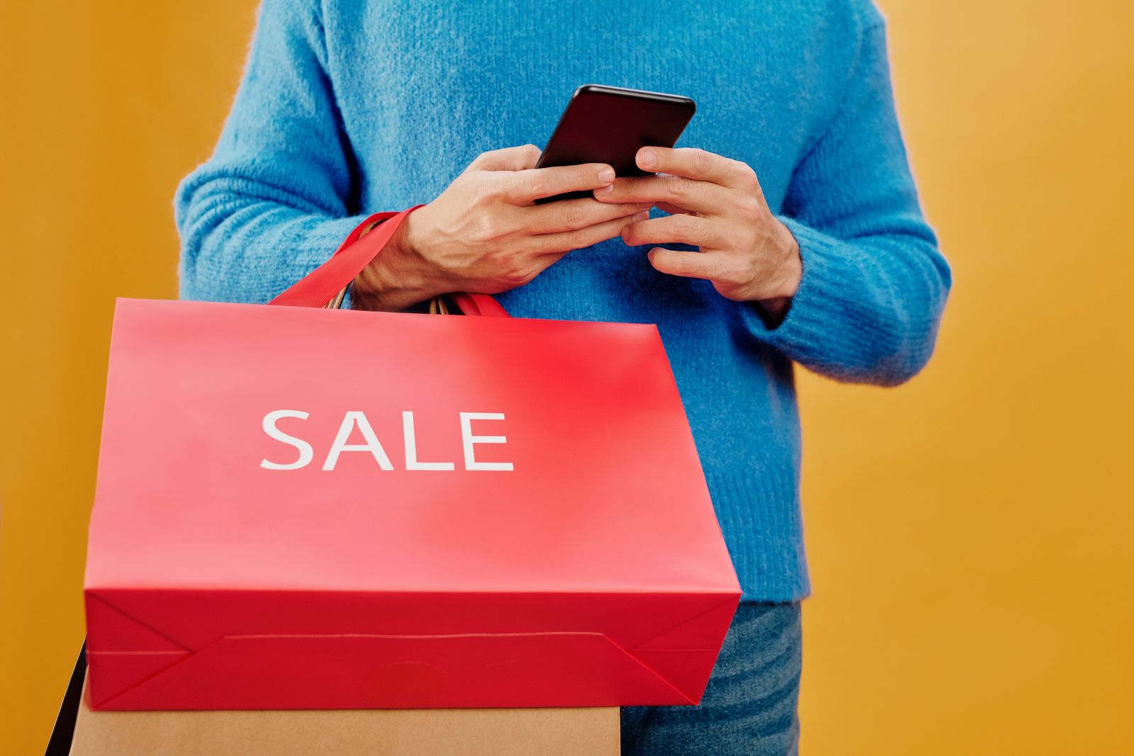 Person browsing an online store on a smartphone while shopping