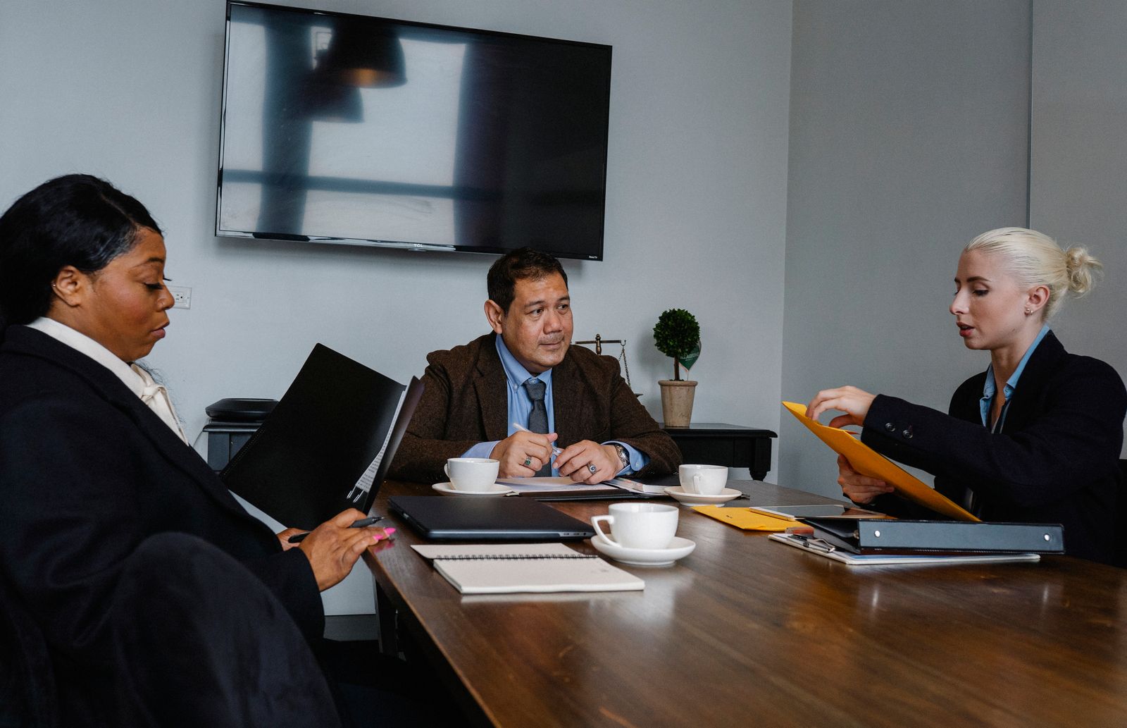 Concentrated colleagues having a technical leadership meeting
