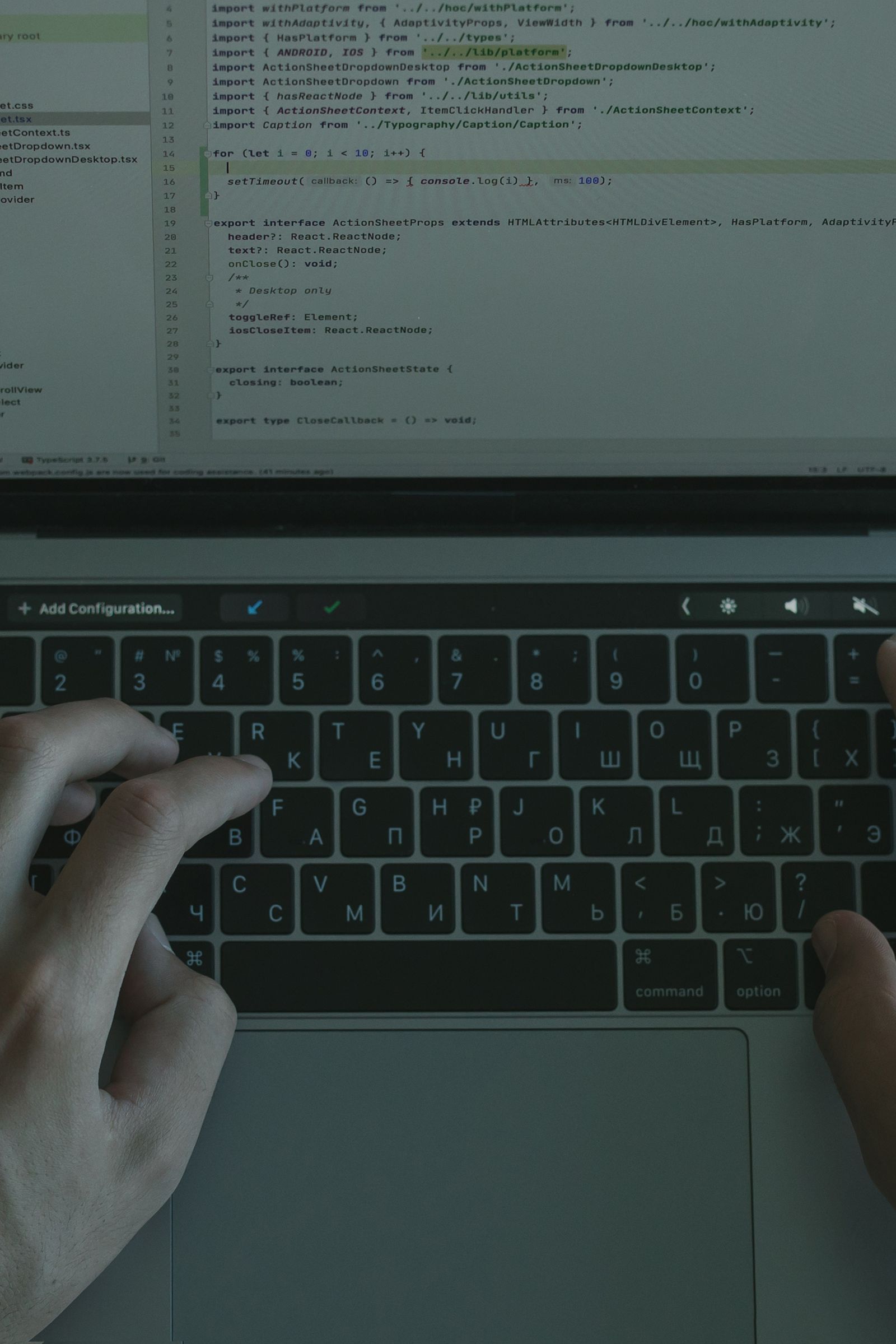 Developer working on connected-device software at a laptop