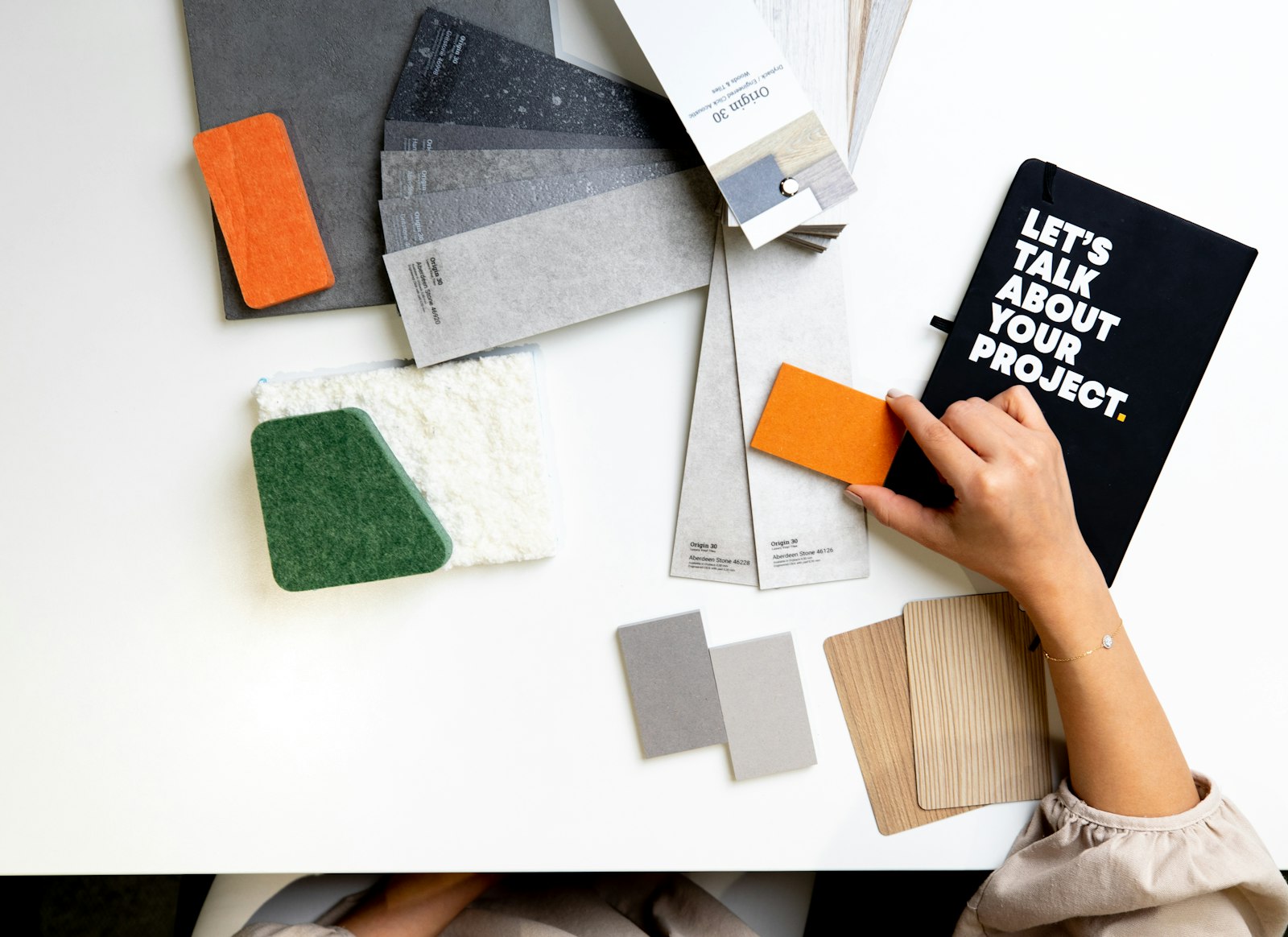 Arranging brand mood-board swatches and material samples