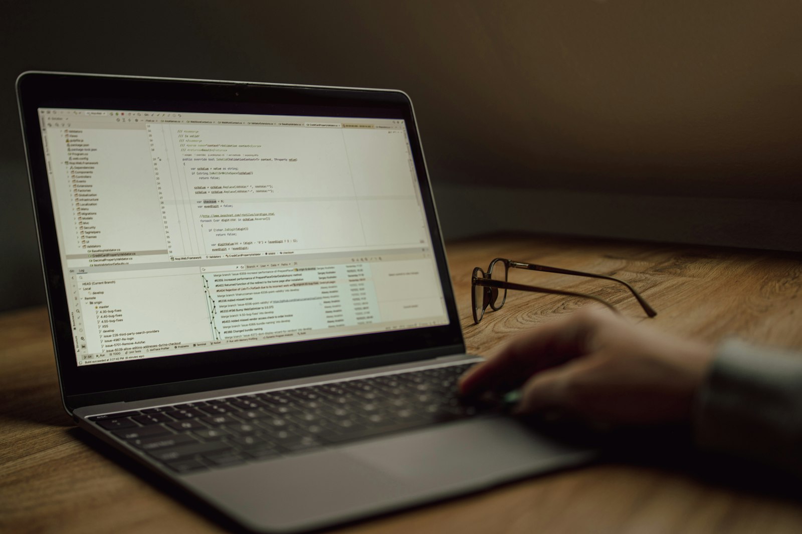Developer typing code on a laptop while building an app