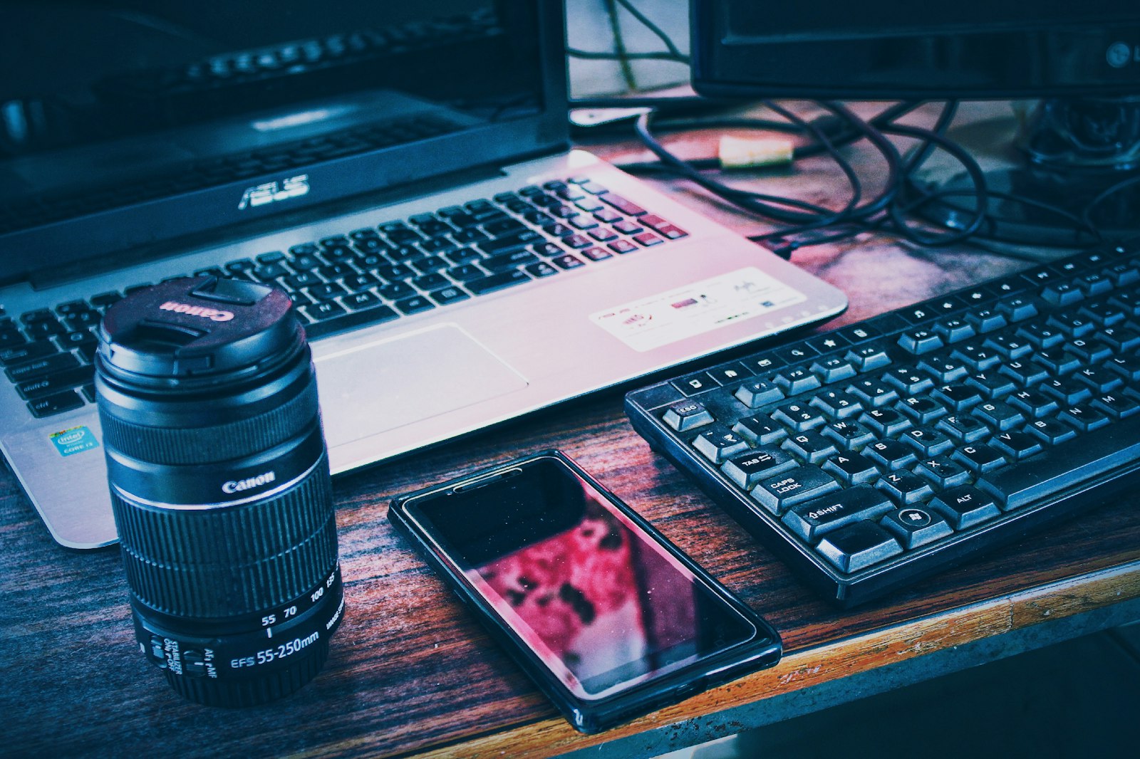 Smartphone and laptop side by side on a desk