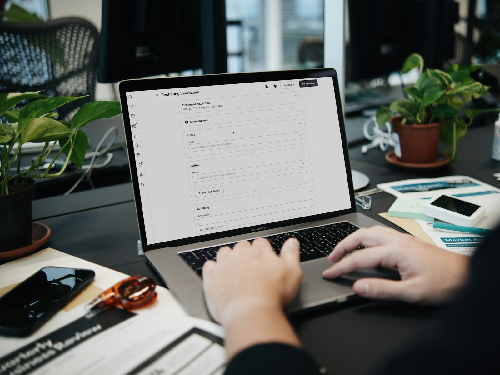 Professional typing on a laptop at a desk