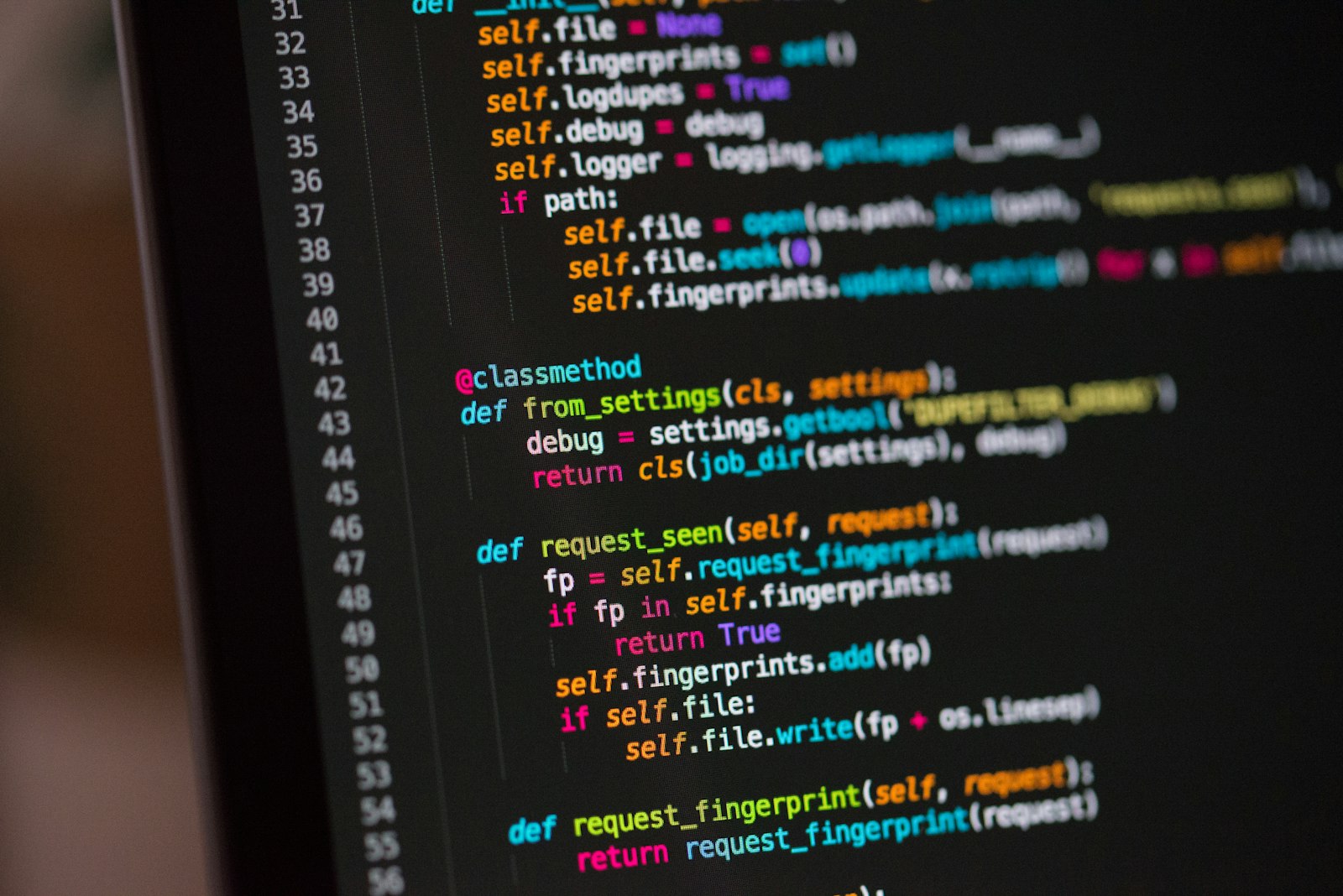 Laptop screen displaying website code during a development session